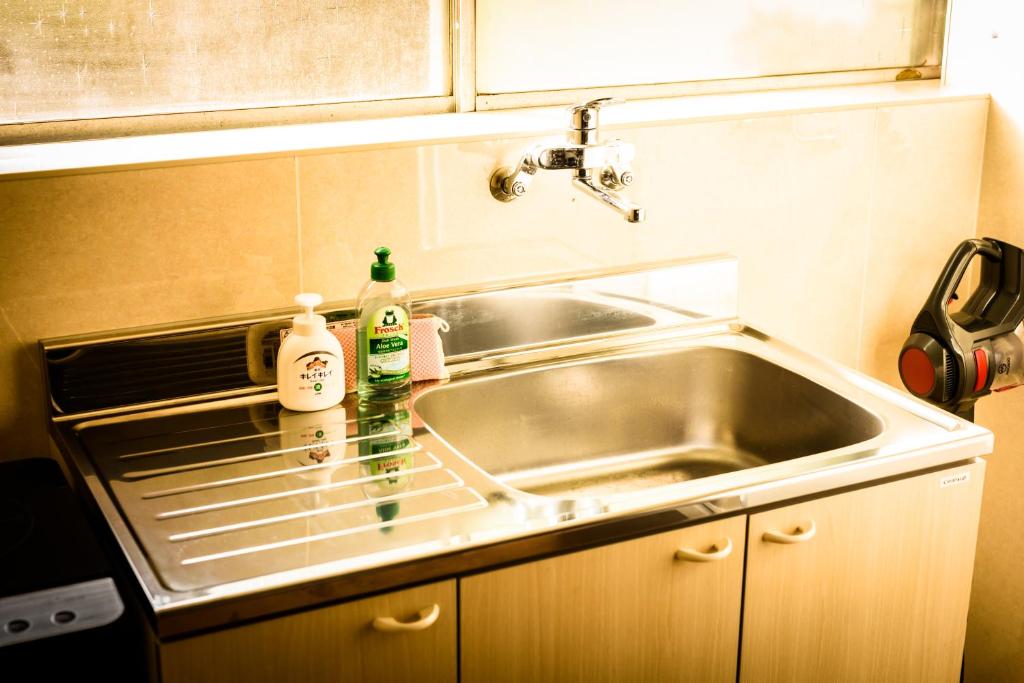 Kuchyň nebo kuchyňský kout v ubytování Biker's Inn Onomichi 自転車の宿おのみち supported by COCOSTAY