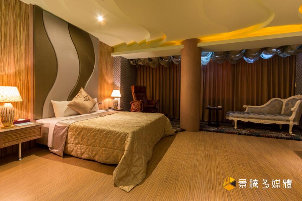 Postel nebo postele na pokoji v ubytování Zheng Yi Hotel & Motel I