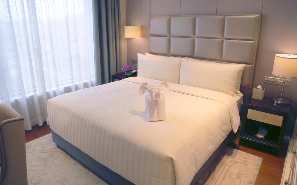 Postel nebo postele na pokoji v ubytování Wyndham Grand Xi'an Residence
