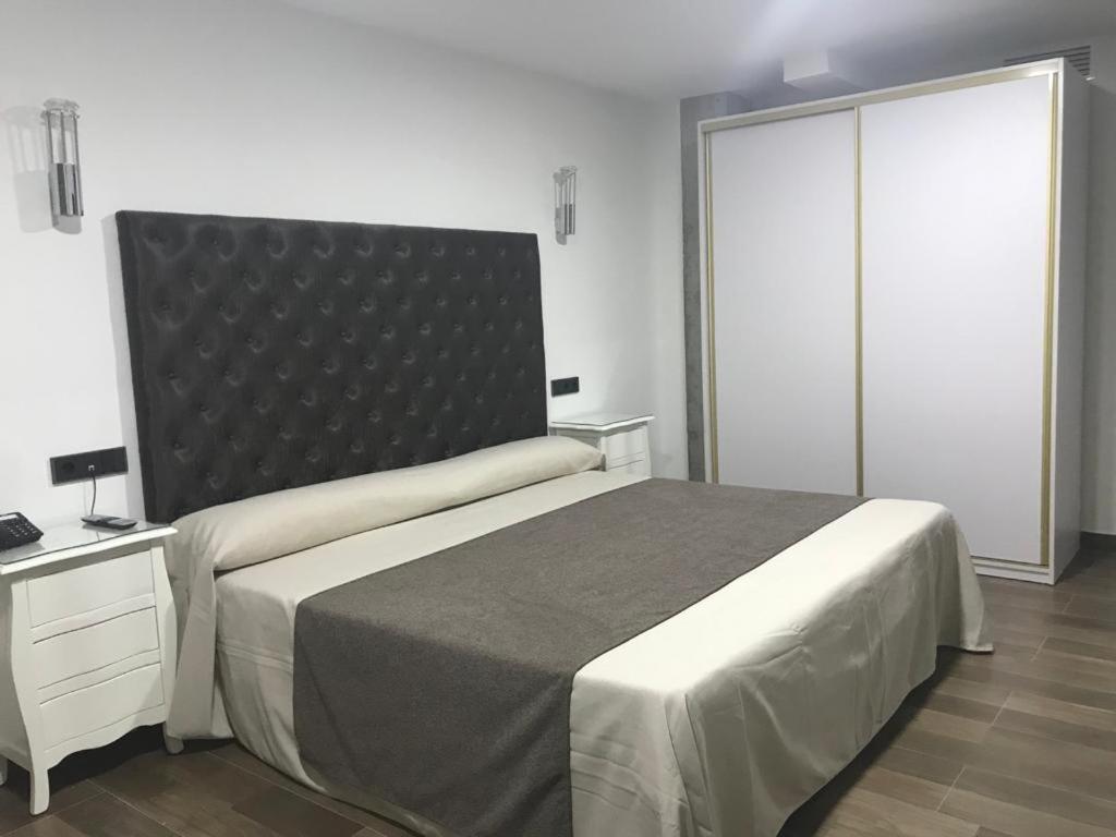 Postel nebo postele na pokoji v ubytování Hotel Julián
