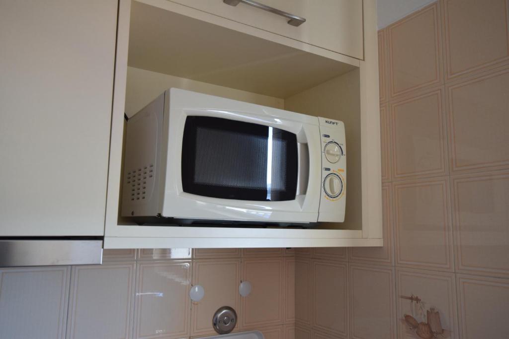 TV a/nebo společenská místnost v ubytování Apartamentos Carruna