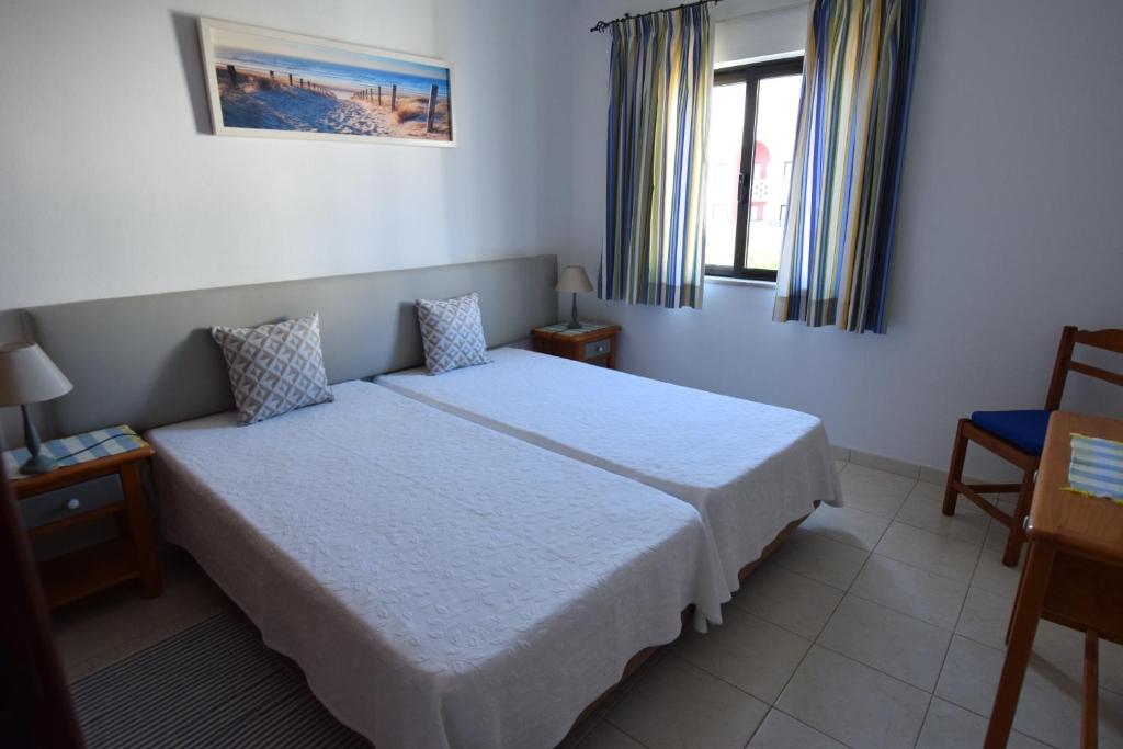 Postel nebo postele na pokoji v ubytování Apartamentos Carruna