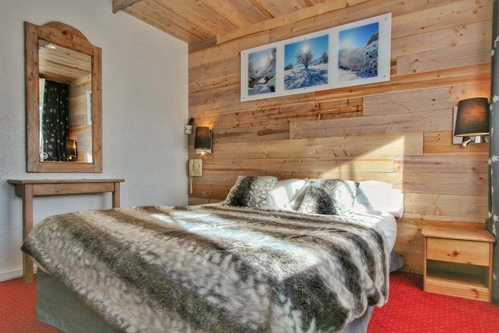 Postel nebo postele na pokoji v ubytování Hotel Le Pelvoux