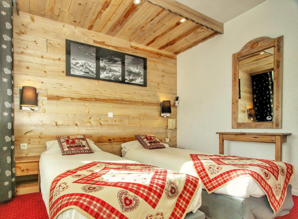 Postel nebo postele na pokoji v ubytování Hotel Le Pelvoux