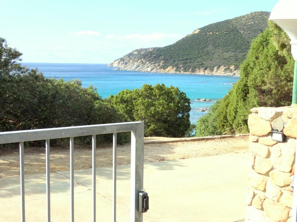 a view of the ocean from the balcony of a house at Villa dell'Arte Vista Mare in Villasimius