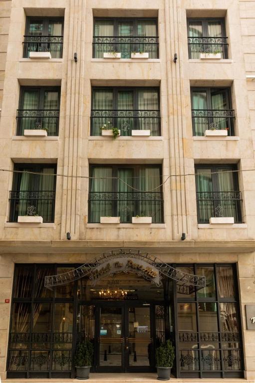 a tall building with windows and a door at Hotel The Pera Hill in Istanbul