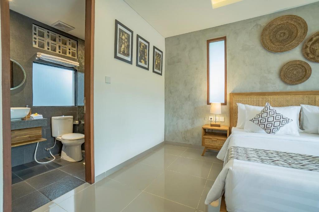 Postel nebo postele na pokoji v ubytování Ranggen Ubud