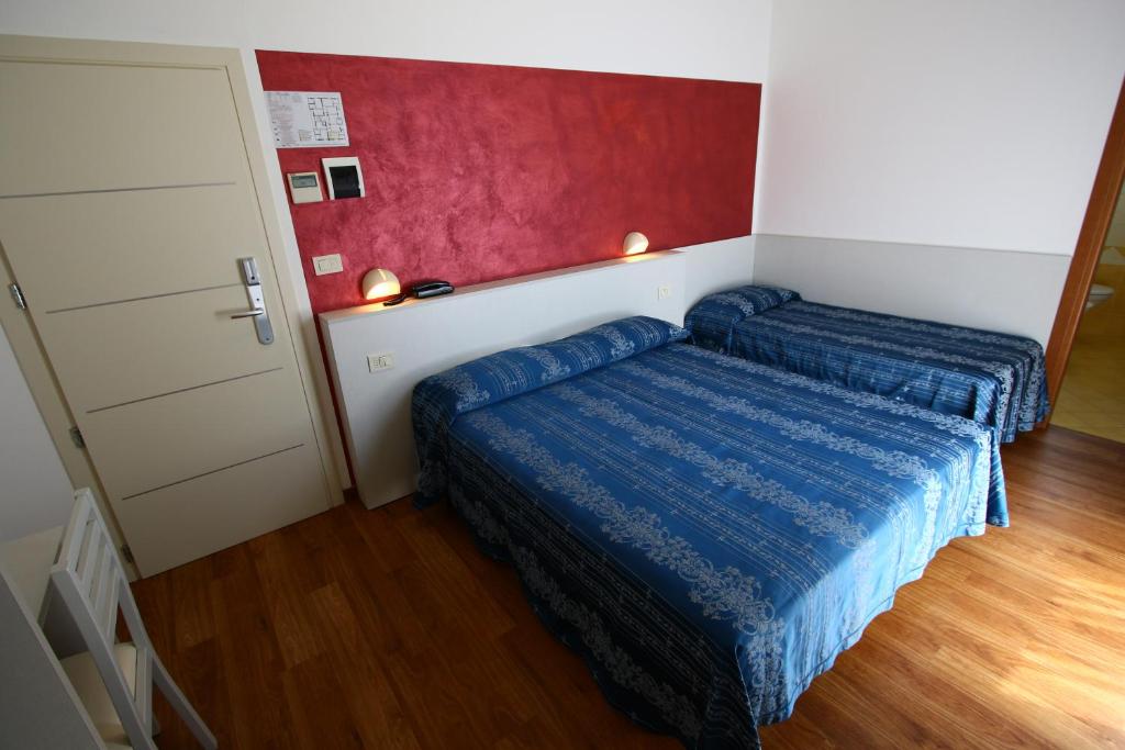 Postel nebo postele na pokoji v ubytování Hotel Arena
