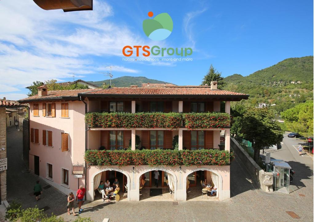 a building with plants on the side of it at Residence Casa Gardola, GTSGroup in Tignale