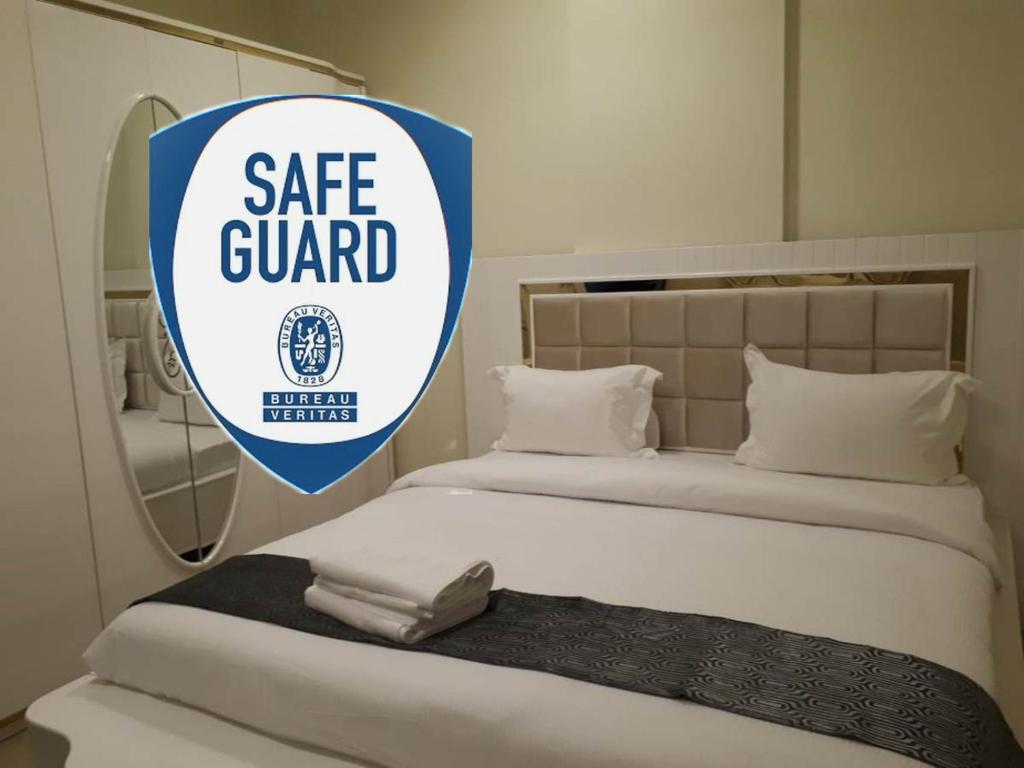 Postel nebo postele na pokoji v ubytování Reef Hotel Aparts (Tabasum Group)