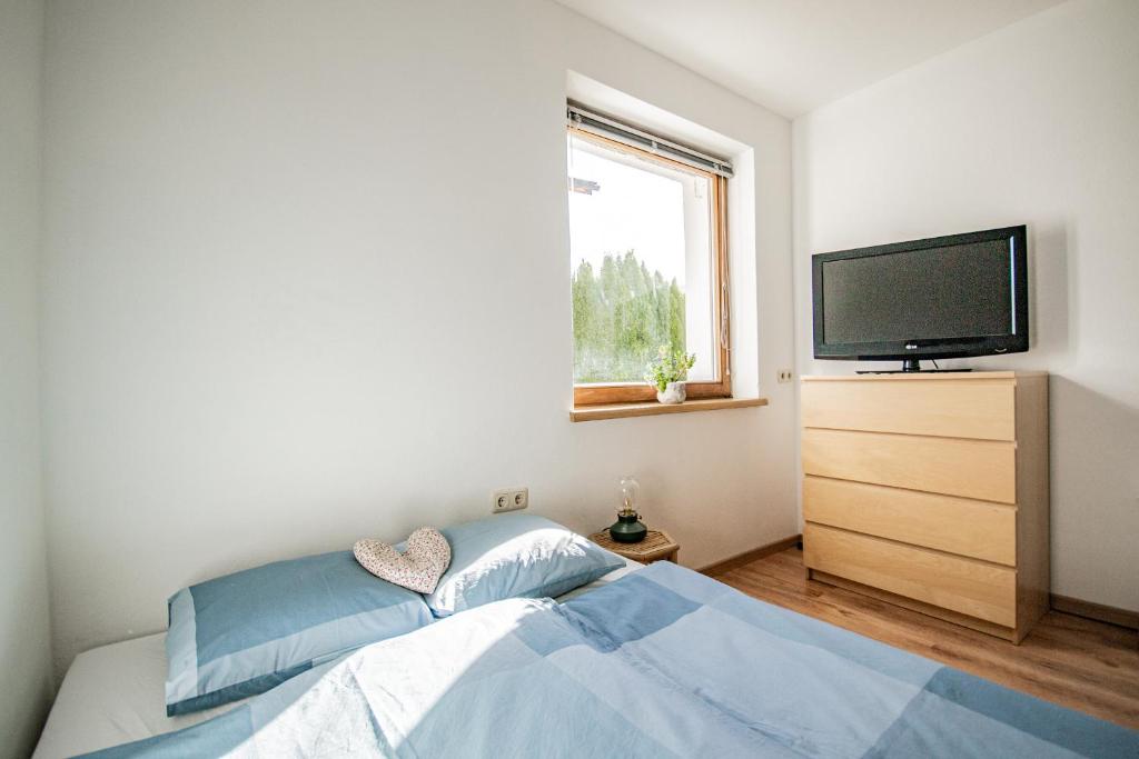 Posteľ alebo postele v izbe v ubytovaní Ferienwohnung mit Terrasse