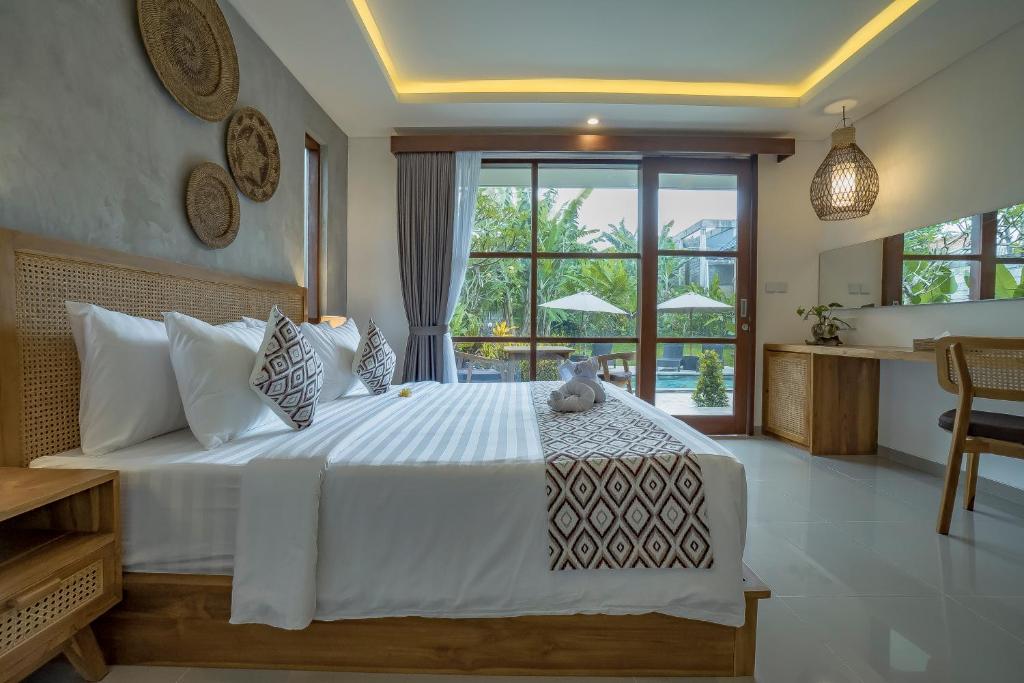 Postel nebo postele na pokoji v ubytování Ranggen Ubud