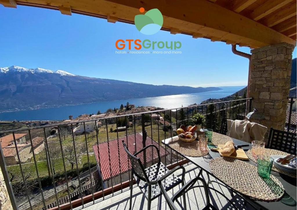 a view of the water from the balcony of a house at La Terrazza sul Lago, GTSGroup in Tignale
