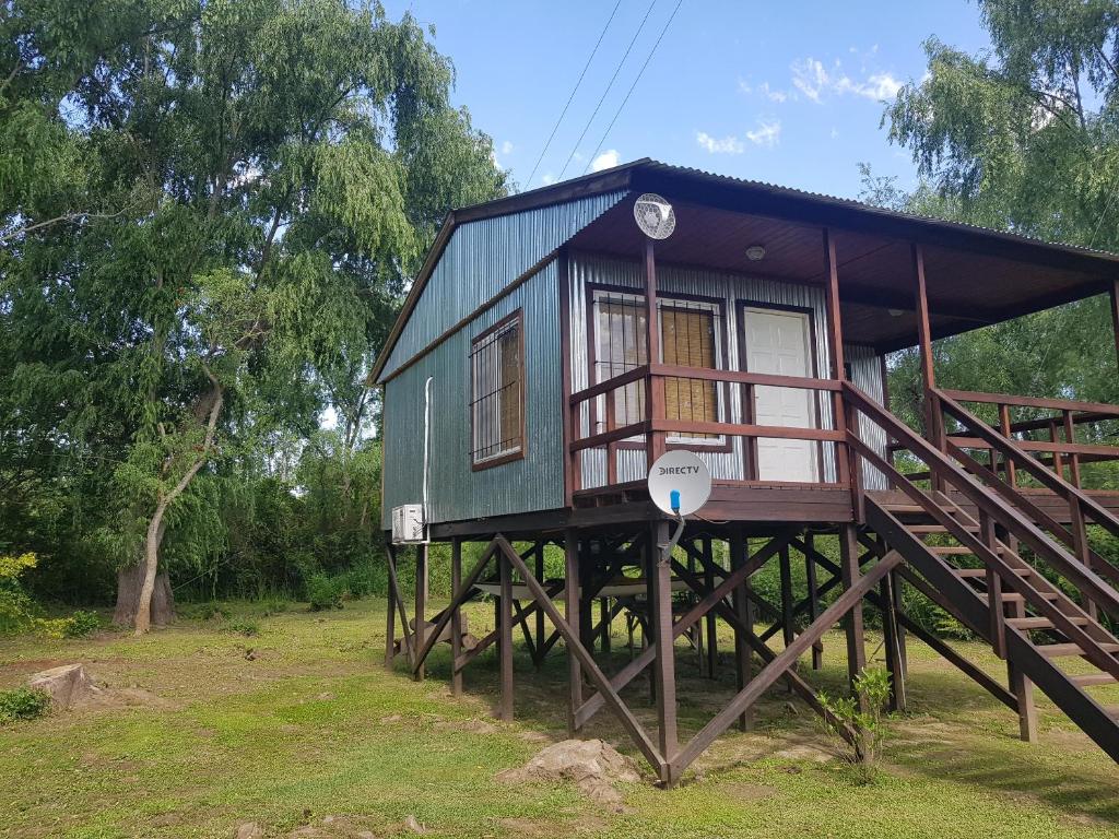 a small house on stilts in a field at Los Sauces in Tigre