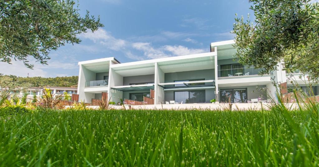 A garden outside Lagomandra Luxury Suites with Private Pools