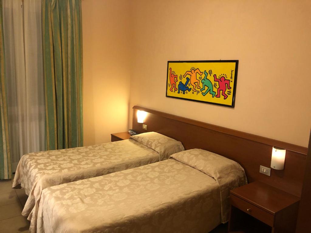 Postel nebo postele na pokoji v ubytování Hotel Paradiso