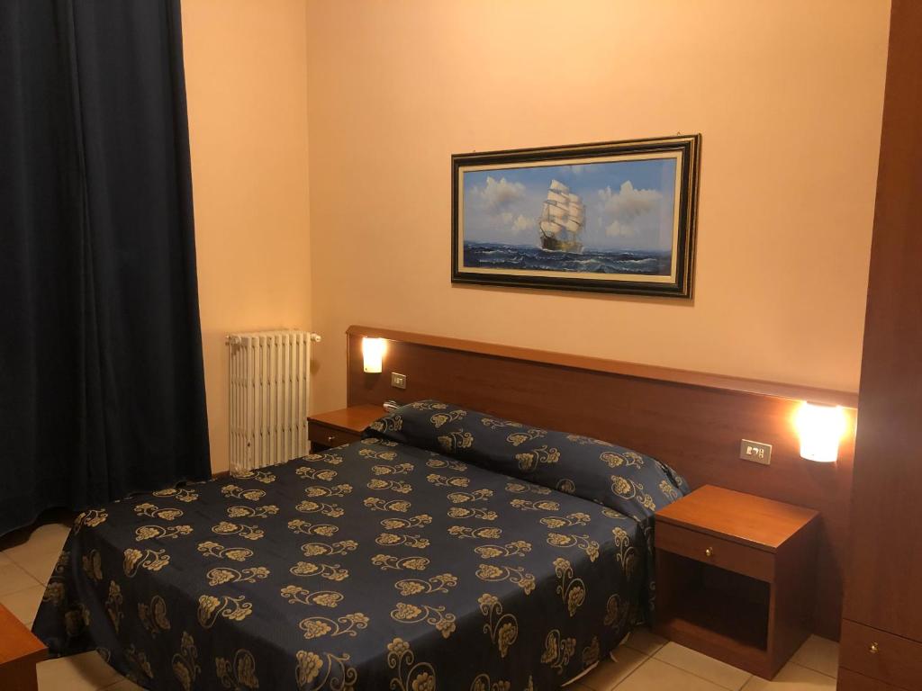 Postel nebo postele na pokoji v ubytování Hotel Paradiso