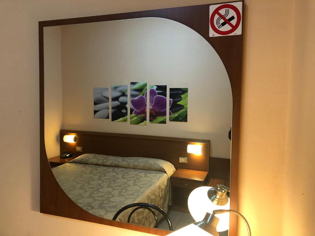 Postel nebo postele na pokoji v ubytování Hotel Paradiso