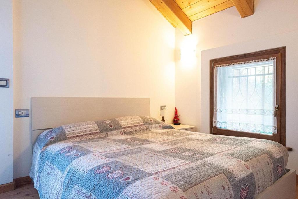 Posteľ alebo postele v izbe v ubytovaní Mansarda 4 posti letto in Villa a Borca di Cadore