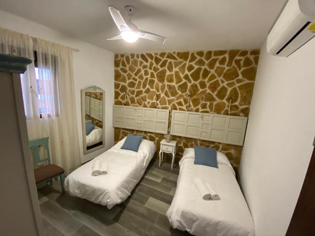 Posteľ alebo postele v izbe v ubytovaní La Posada de Bartolo.