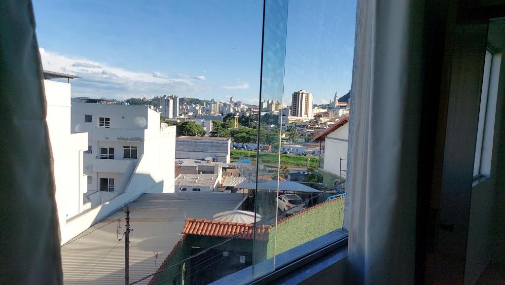 a view of a city from a window of a building at Barato e confortável AP 104 in Novo Horizonte