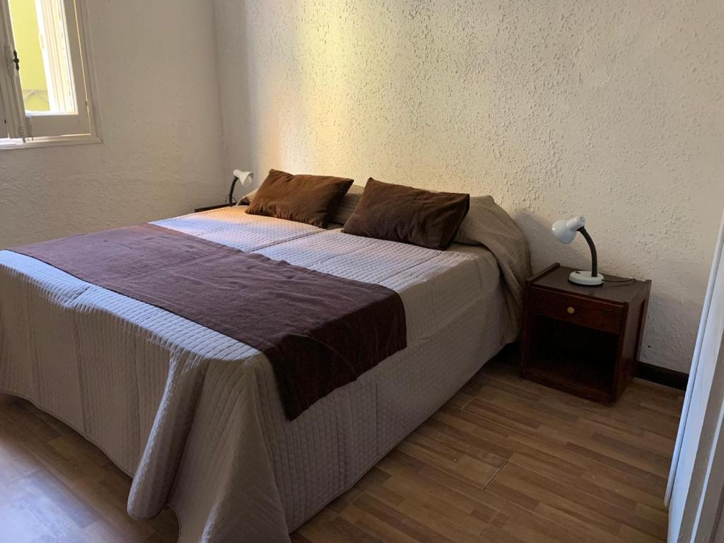 Postel nebo postele na pokoji v ubytování Hotel American