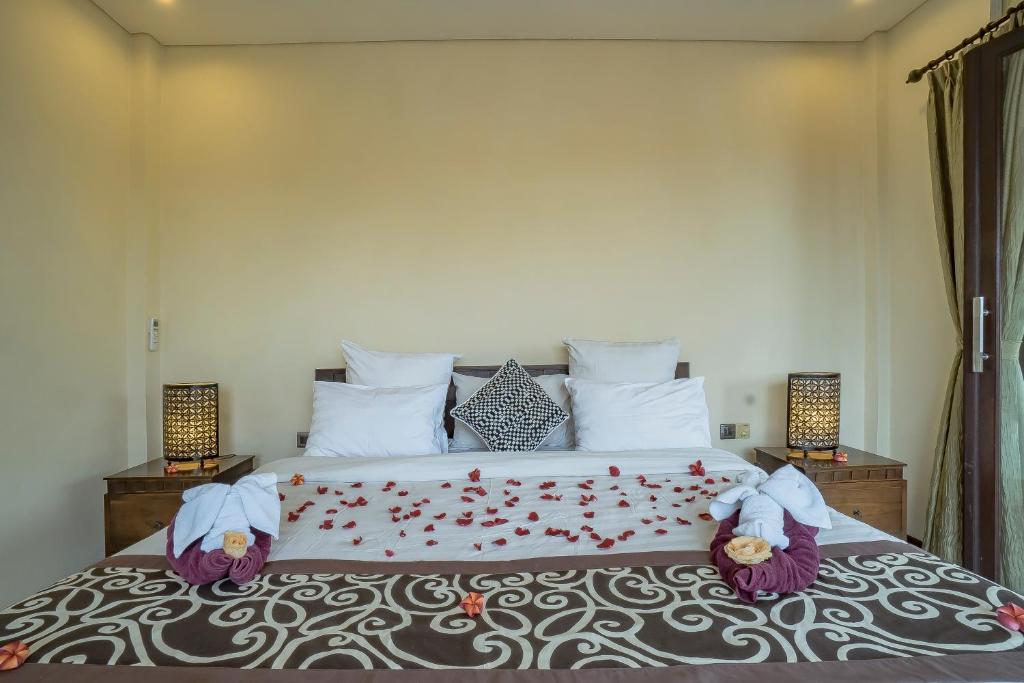 Postel nebo postele na pokoji v ubytování Iman Homestay Ubud
