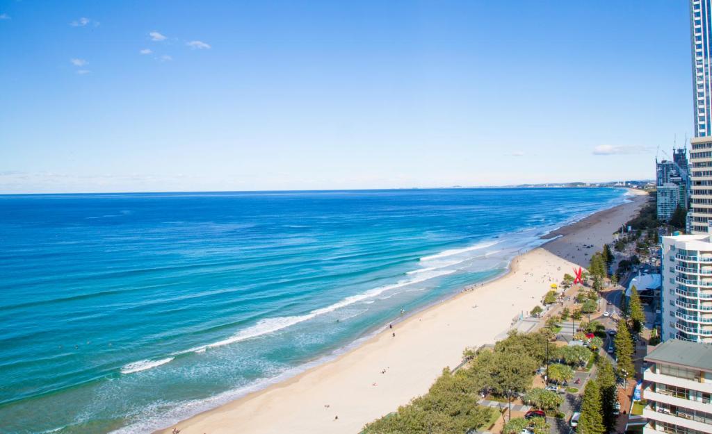 an aerial view of a beach and the ocean at Chateau Beachside Resort in Gold Coast