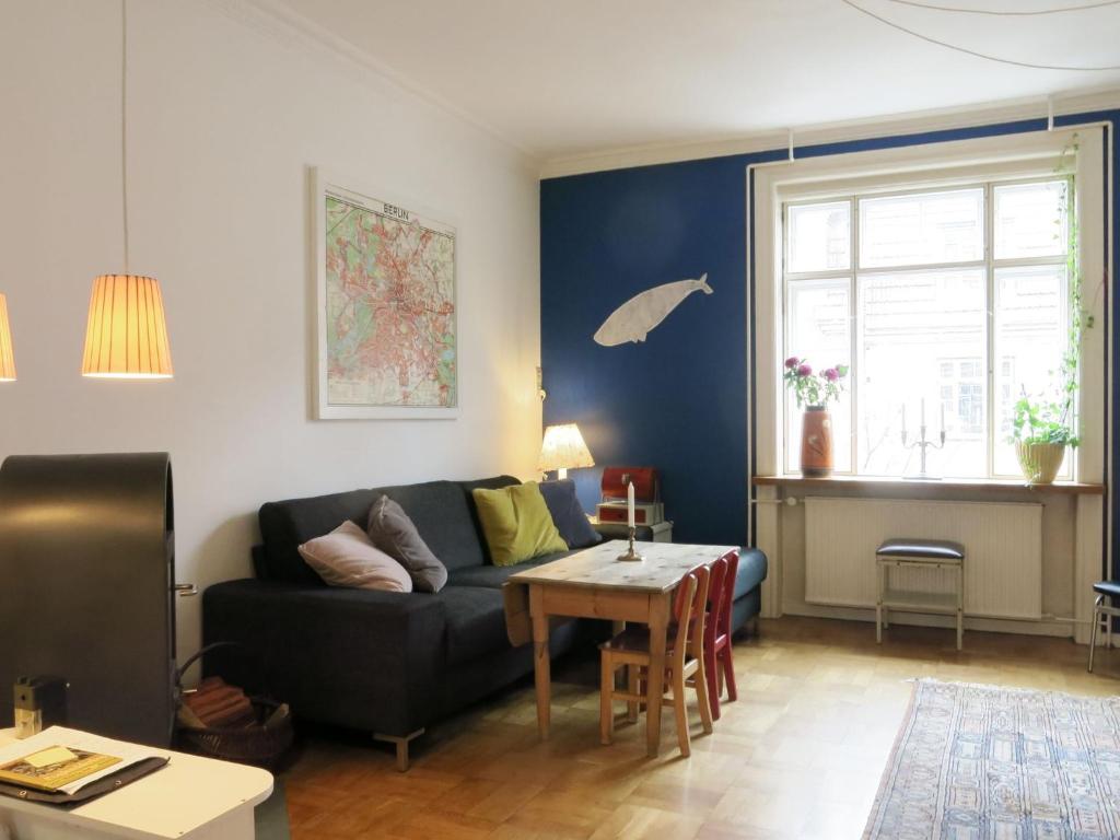 a living room with a couch and a table at ApartmentInCopenhagen Apartment 1354 in Copenhagen