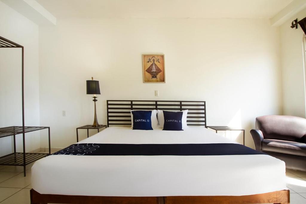 Postel nebo postele na pokoji v ubytování Hotel Plaza Galindo
