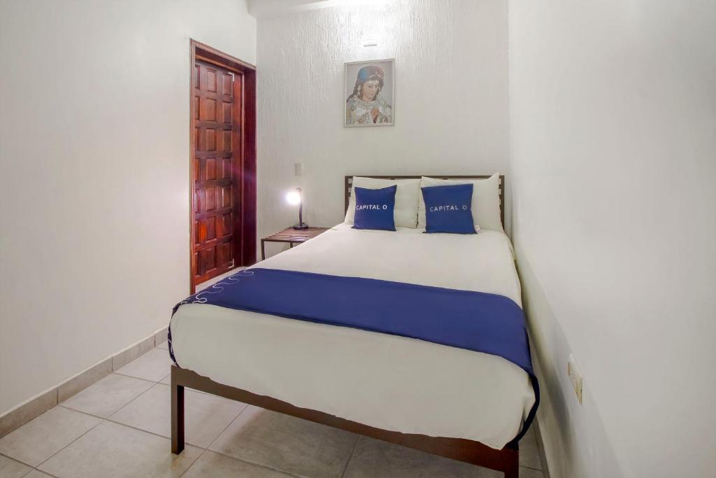 Postel nebo postele na pokoji v ubytování Hotel Plaza Galindo