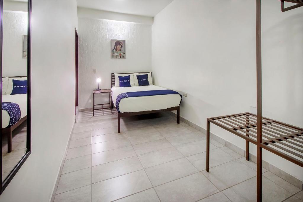 Postel nebo postele na pokoji v ubytování Hotel Plaza Galindo