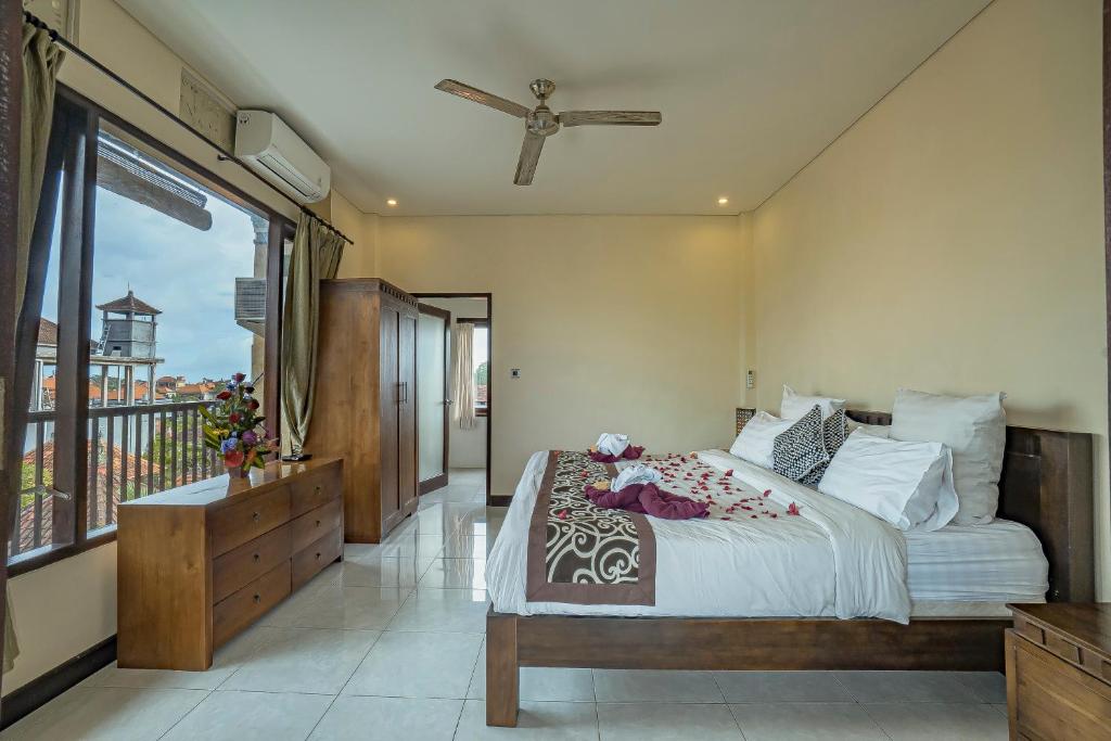 Postel nebo postele na pokoji v ubytování Iman Homestay Ubud