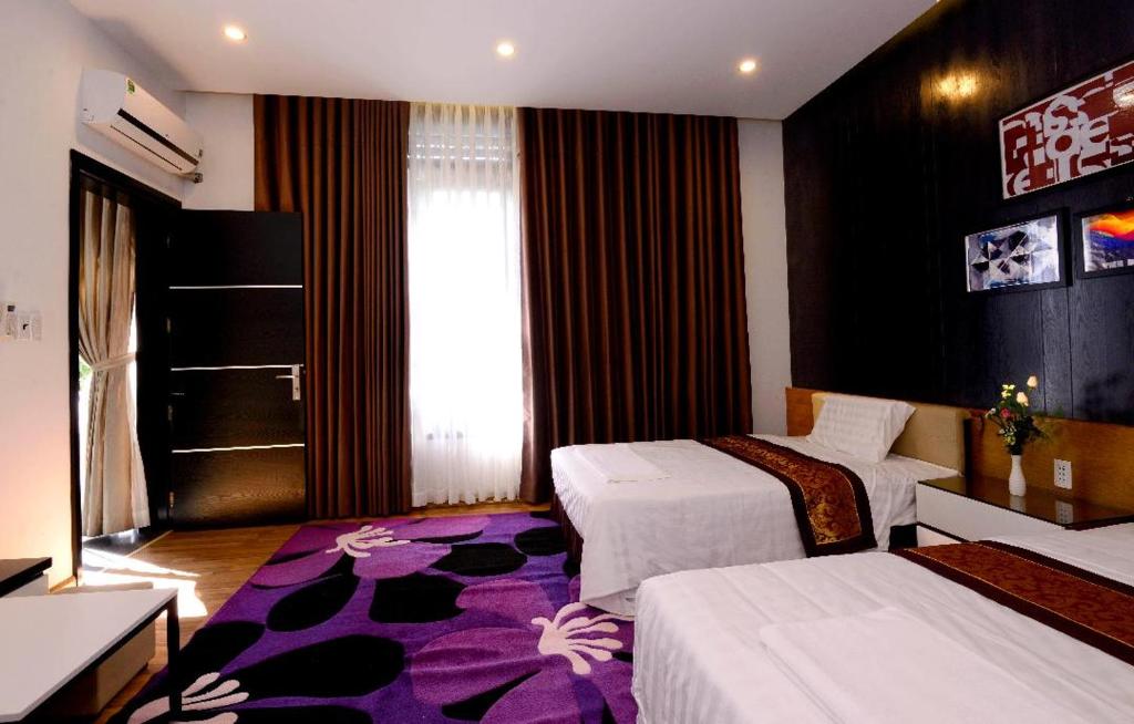 Postel nebo postele na pokoji v ubytování Đồi Sao Homestay