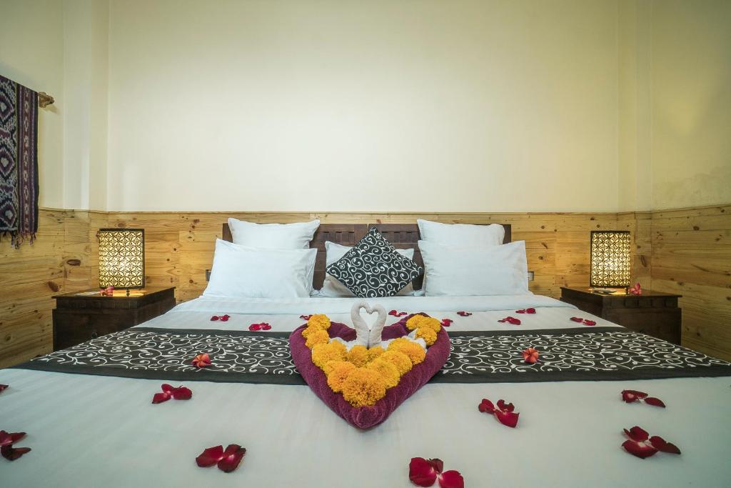 Postel nebo postele na pokoji v ubytování Iman Homestay Ubud