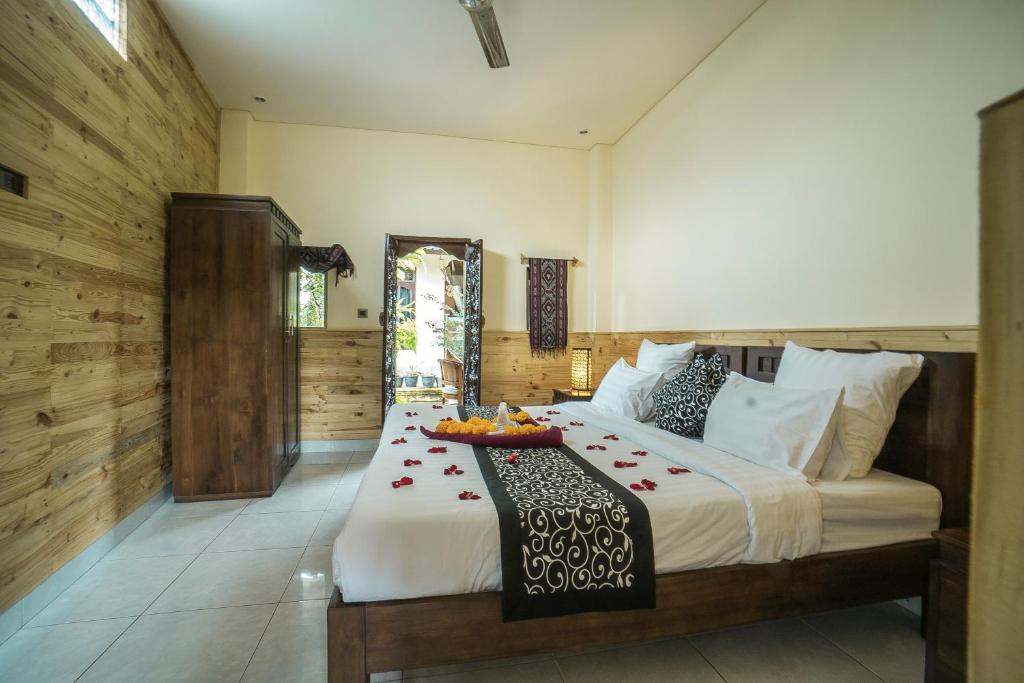 Postel nebo postele na pokoji v ubytování Iman Homestay Ubud