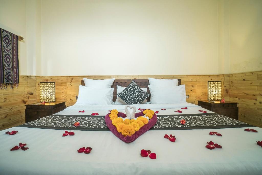 Postel nebo postele na pokoji v ubytování Iman Homestay Ubud