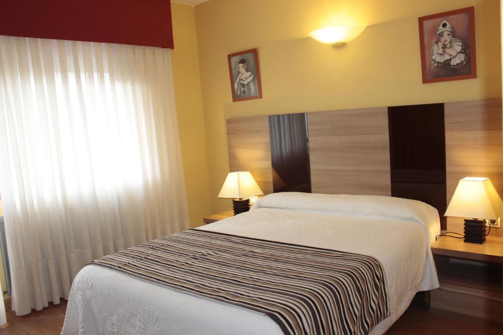 Postel nebo postele na pokoji v ubytování Hotel Peñagrande