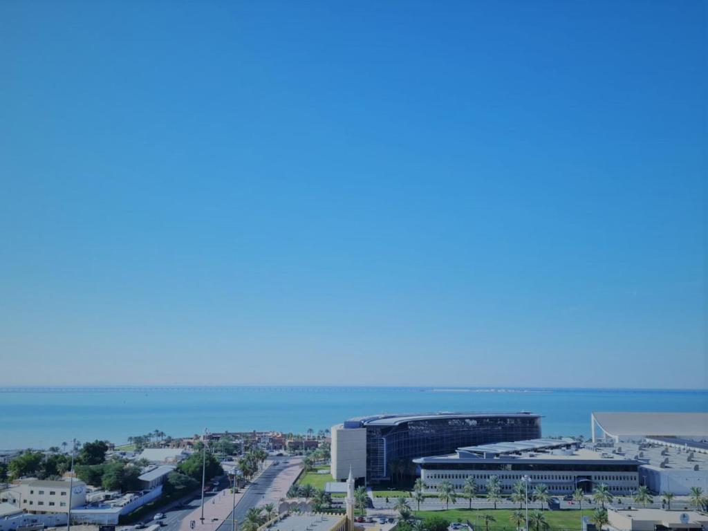 a view of a city and the ocean at Carlton Tower Hotel Kuwait in Kuwait