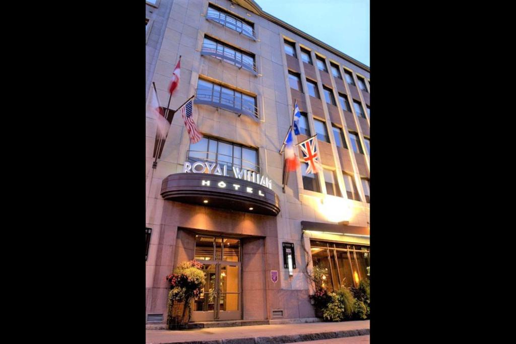 a hotel with a sign on the front of a building at Hotel Royal William, Ascend Hotel Collection in Quebec City