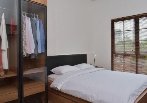 Postel nebo postele na pokoji v ubytování Rumanami Residence