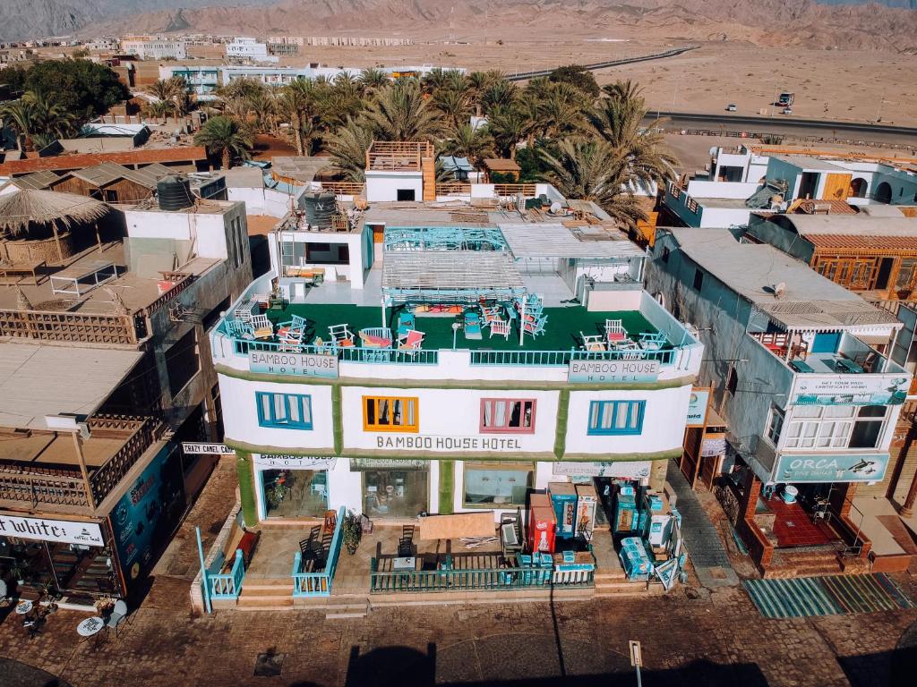 an aerial view of a building in a city at Bamboo House Hotel Dahab in Dahab