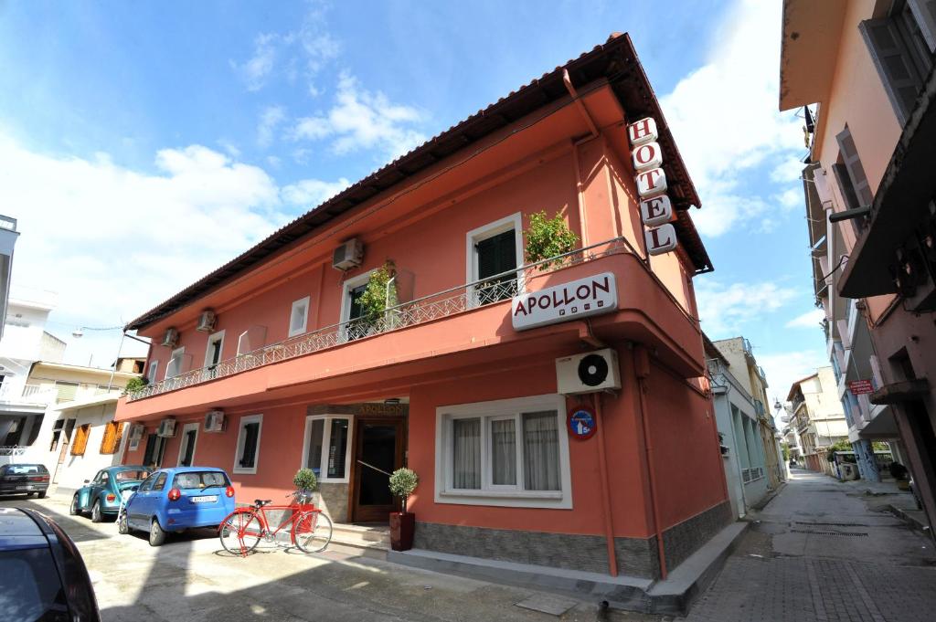 a orange building with a sign on the side of it at Apollon Hotel in Argos