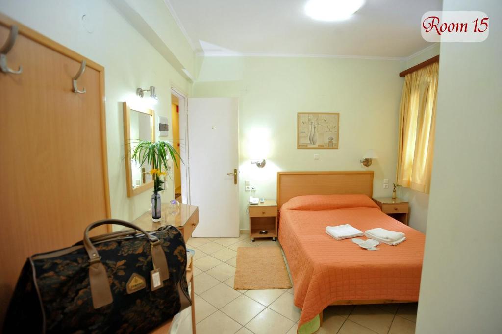 Postel nebo postele na pokoji v ubytování Apollon Hotel