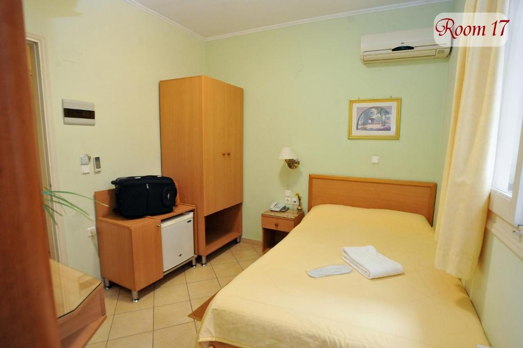 Postel nebo postele na pokoji v ubytování Apollon Hotel