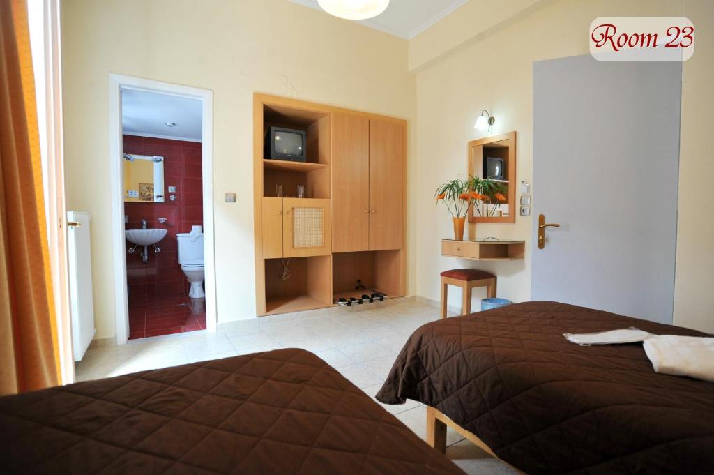 Postel nebo postele na pokoji v ubytování Apollon Hotel