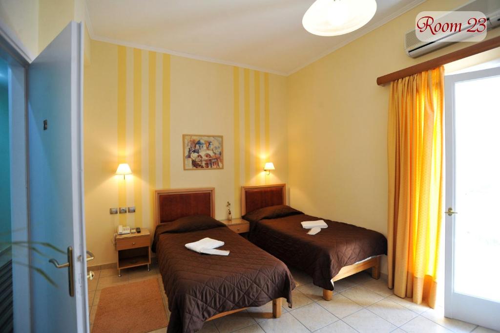 Postel nebo postele na pokoji v ubytování Apollon Hotel