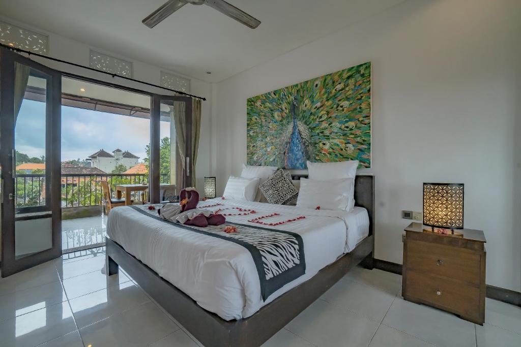 Postel nebo postele na pokoji v ubytování Iman Homestay Ubud