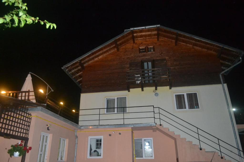 a large building with a balcony on top of it at Vila Pitty in Sinaia