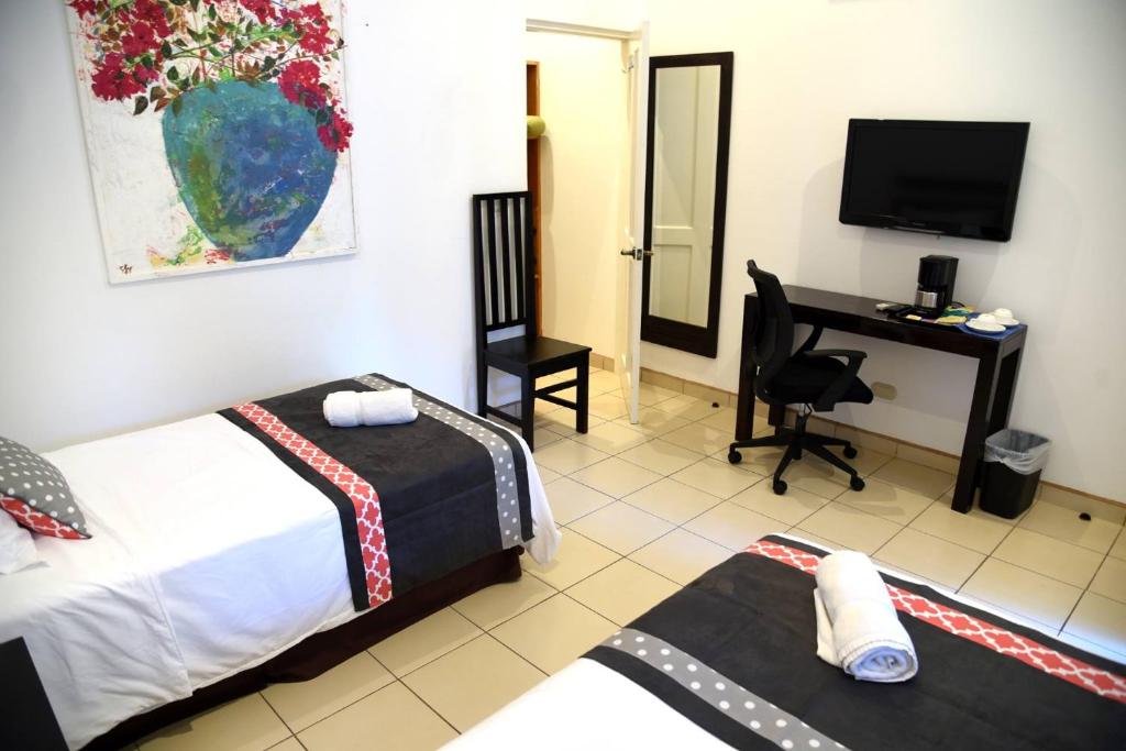 Postel nebo postele na pokoji v ubytování Seis Playas Hotel